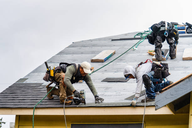 Professional Gutter Installation technician working in Manly, IA